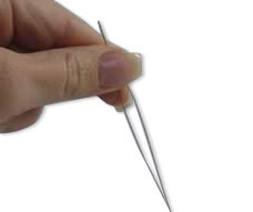 Holding a needle open